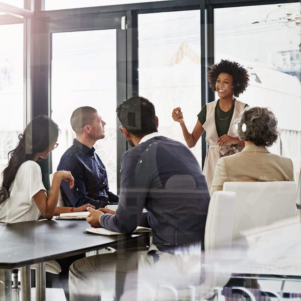 Executive leaders across core functions like Finance, HR, and Operations collaborating to drive business growth – Millman Search